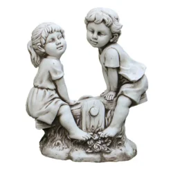 Statue fille et garcon bascule